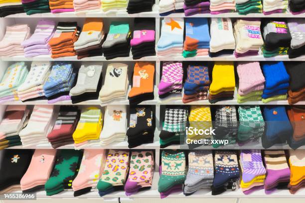 Multi Colored Socks Stacked On Shelves In The Store Socks With Various Patterns Stock Photo - Download Image Now