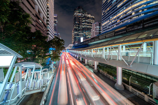 The City with light trails road background for Business connection and technology concept, The Business district in Bangkok city Thailand, Cityscape  background for Connectivity Concept