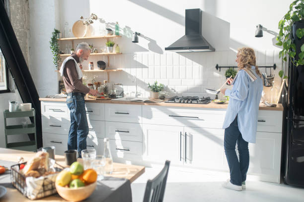 istock Mature couple cooking breakfast together 1455387099