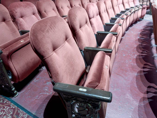 Empty red seats of a theater after the curfew regarding corona virus