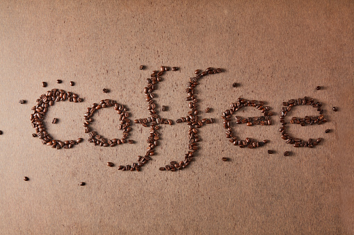 Coffee spelling word made of coffee beans