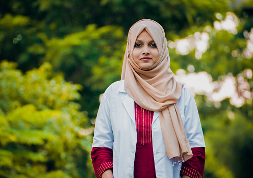Closeup portrait of friendly, smiling confident Muslim female doctor.