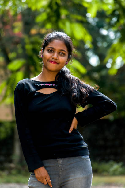 istock Portrait of attractive young Indian model posing with hands on hips. 1455397161