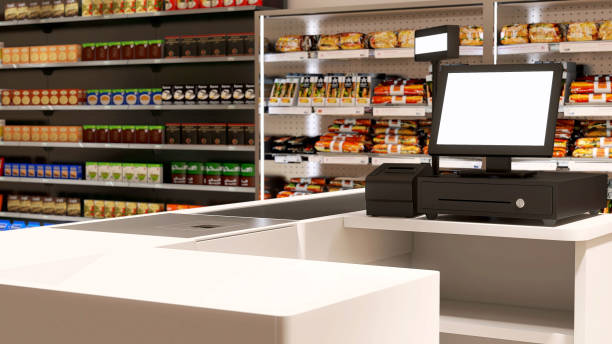 Black cash register with blank computer monitor screen, barcode scanner at checkout cashier counter in supermarket stock photo