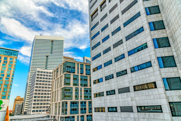 The top portion of several downtown modern skyscrapers located in the city of Houston, Texas