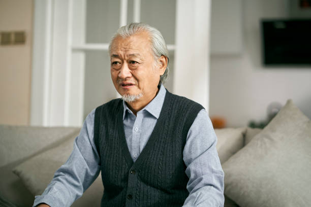 istock asian old man weeping at home 1455398982