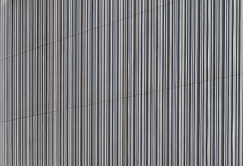 Close-up of vertical striped white concrete wall.