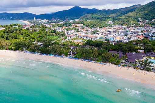 Aerial tropical landscape of Kata Beach and Andaman sea. Drone view over the coastline of Phuket city, a famous travel destination in the South of Thailand.