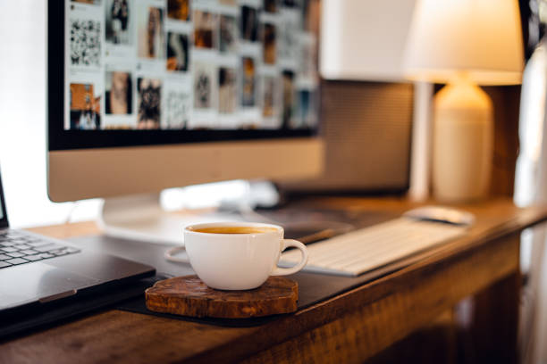 Coffee on the computer desk at home