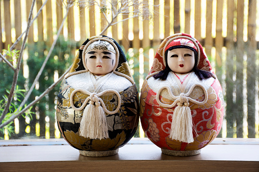 Japanese antique and ancient traditional dolls Dogo no hime and nishiki daruma for show and sale for thai people and foreign travelers travel visit buy in local souvenir gift shop in Bangkok, Thailand