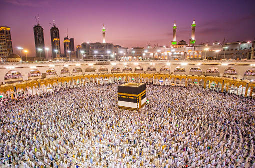 Muslim pilgrims from all around the world doing tawaf, praying around the kabah in Mecca, Saudi Arabia, during hajj and umra period.