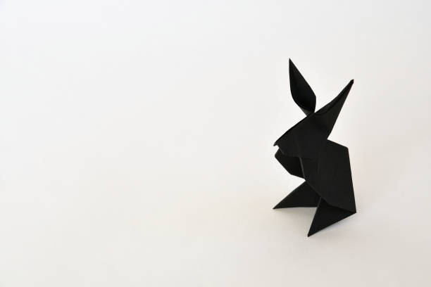 Cute origami snakes on white background