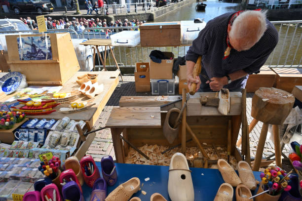 Traditional Dutch, Netherlands, Holland, wooden clogs for souvenir or traveling etc isolated on wooden background with copy space for your own text