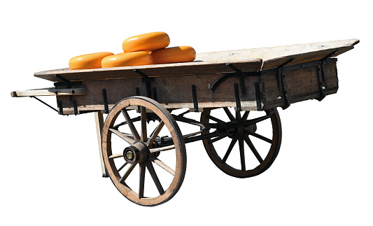 Traditional Holland carriage with cheese on white background
