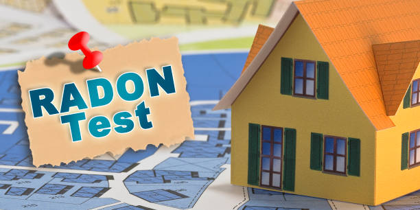 The danger of natural radon gas in our homes - Radon Testing concept with an home model stock photo