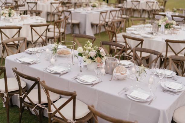 istock outdoor event, white chairs and tables placed outside 1455418233