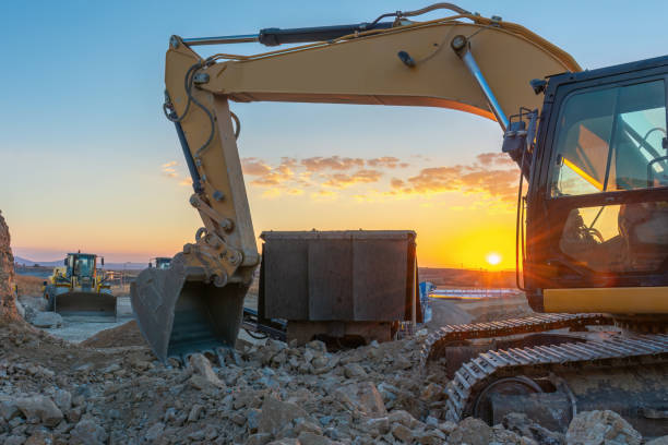 istock Excavator building a road in a site construction 1455418259