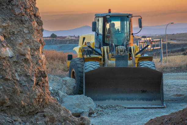 istock Excavator building a road in a site construction 1455418262