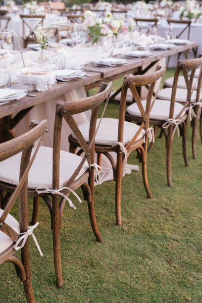 istock outdoor event, white chairs and tables placed outside 1455418293