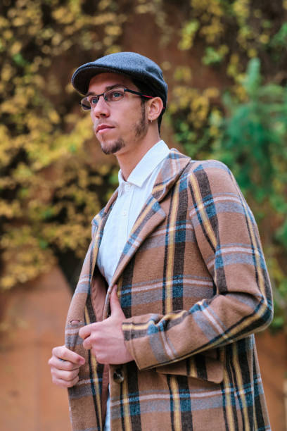 istock Stylish man with glasses standing outdoors. 1455423705