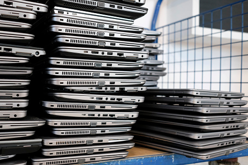 Big stacks of discarded laptops, notebooks on a trolley
