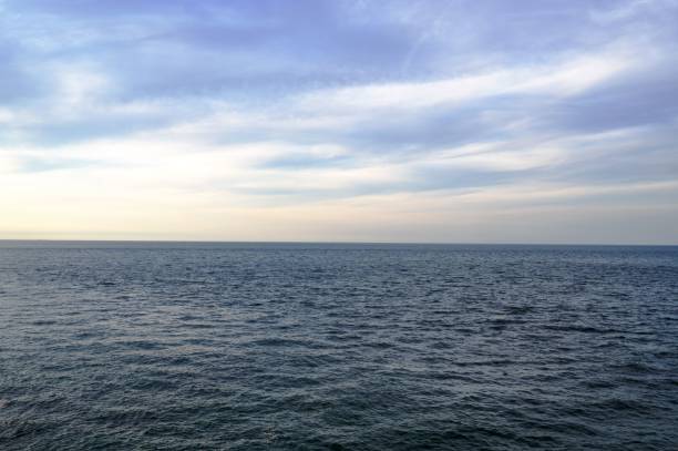 istock Oceanscape with a cloudy sky in the background perfect for wallpapers and backgrounds 1455431363