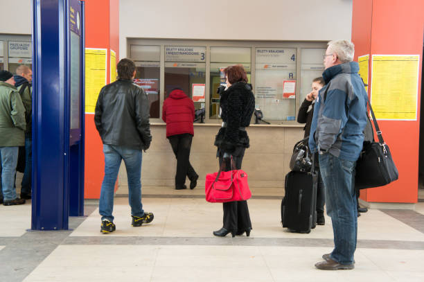 Warsaw, Poland – April 02, 2013: People at the ticket counter of the train station
