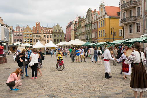 Poznan, Poland – May 18, 2013: Many people at the old square enjoying the good weather. This are the first warm days after a long cold period.