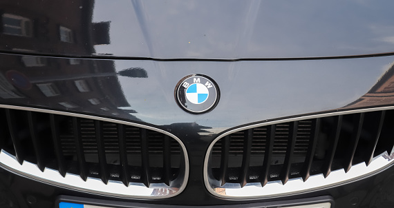 Kiel, Germany – May 15, 2021: Closeup of the BMW logo on a new car front