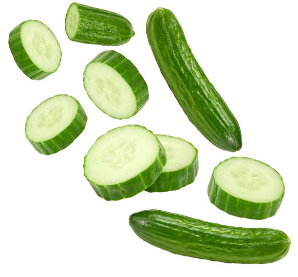 istock flying cucumbers with slices isolated on white background. clipping path 1455433383