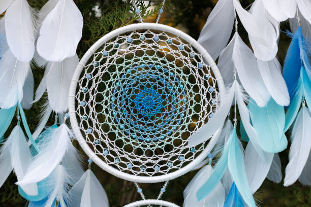 istock Handmade dream catcher with feathers threads and beads rope hanging 1455433826