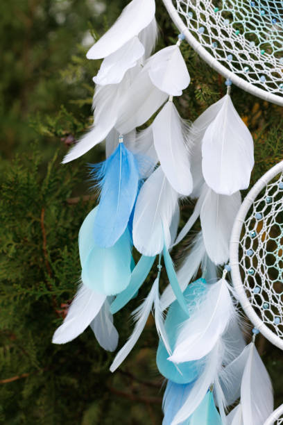 istock Handmade dream catcher with feathers threads and beads rope hanging 1455434076