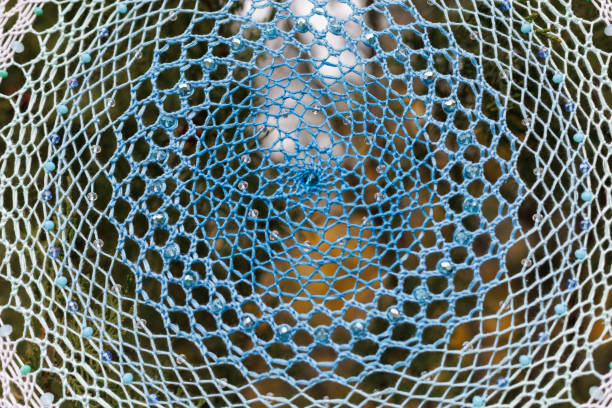 Dream catcher with feathers threads and beads rope hanging. Dreamcatcher handmade
