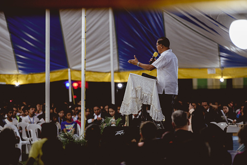 La Carlota City, Philippines – March 01, 2019: A man sharing a message at the Evangelistic religious Christian tent revival meeting, Philippines