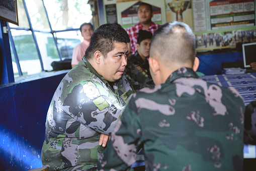 La Carlota City, Philippines – March 01, 2019: Filipino military personnel is having a meeting