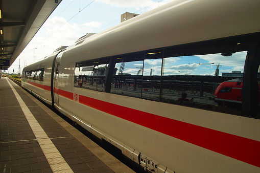 Frankfurt, Germany – August 20, 2021: An Intercity Express ICE3 on the platform at Frankfurt Central Station. Backlight and reflection.