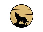 istock Wolf with full moon behind 1455435479