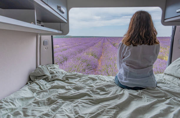 istock Woman looking at lavender fields from a camper 1455437861