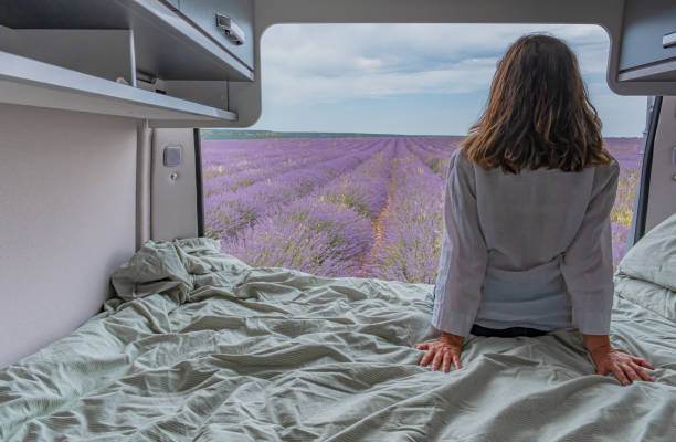 istock Woman looking at lavender fields from a camper 1455437889