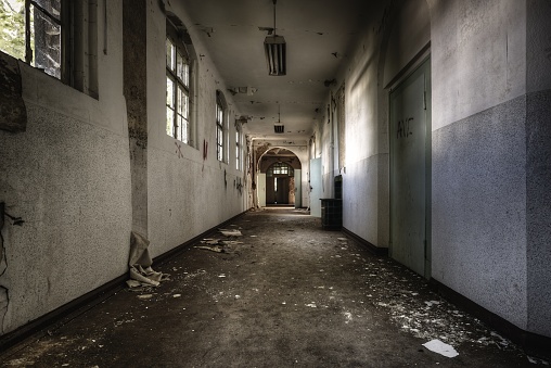 A shot of an abandoned and damaged hallway.