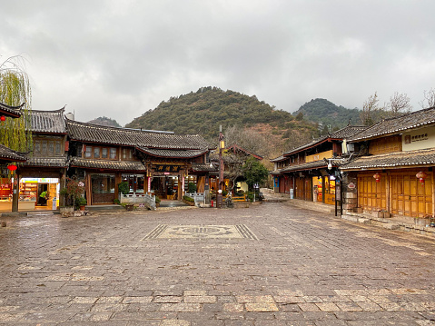 December 18, 2022—Lijiang, Yunan, China: Lijiang Ancient City (Dayan Old Town) on the Yungui Plateau has a history of more than 700 years. It is a well-preserved Naxi ancient town, listed as UNESCO World Heritage site in 1997. It is one of the four best-preserved ancient cities in China. In the vicinity area of Lijiang, there are also many other beautiful ancient towns. Here is the Square Market of Shuhe Ancient Town.