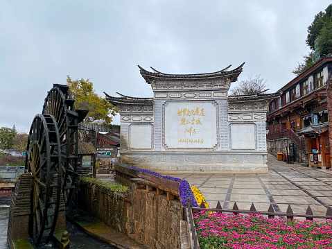 December 18, 2022—Lijiang, Yunan, China: Lijiang Ancient City (Dayan Old Town) on the Yungui Plateau has a history of more than 700 years. It is a well-preserved Naxi ancient town, listed as UNESCO World Heritage site in 1997. It is one of the four best-preserved ancient cities in China. Here is the monument incarved the words of former president of China.