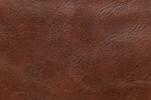 couro marrom e fundo texturizado. - car leather hide seat - fotografias e filmes do acervo