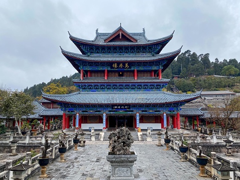 December 18, 2022—Lijiang, Yunan, China: Lijiang Ancient City (Dayan Old Town) on the Yungui Plateau has a history of more than 700 years. It is a well-preserved Naxi ancient town, listed as UNESCO World Heritage site in 1997. It is one of the four best-preserved ancient cities in China.  Here is the Wanjuan Building inside the Mu Mansion.