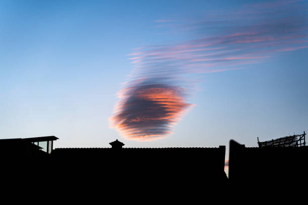 istock Cirrus clouds on the roof blown away by the wind, fire clouds, sunset 1455440557