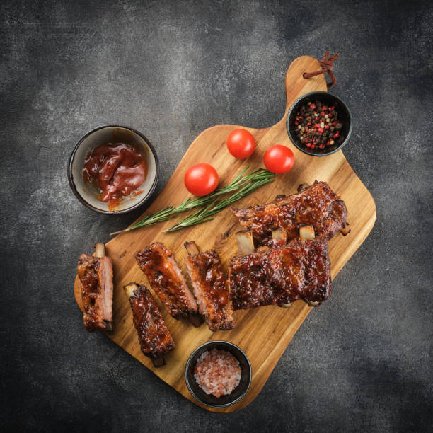 istock Delicious smoked pork ribs glazed in BBQ sauce. 1455441162