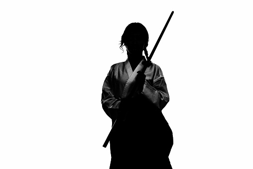 Martial artist holding a wooden sword.