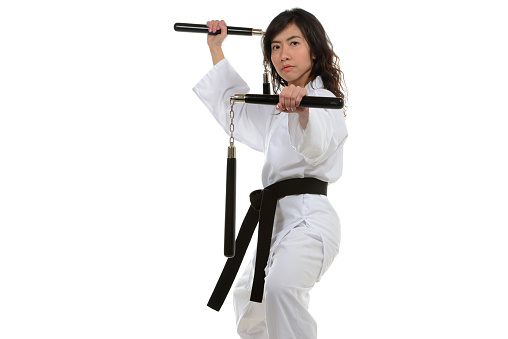 Martial artist with two nunchakus.