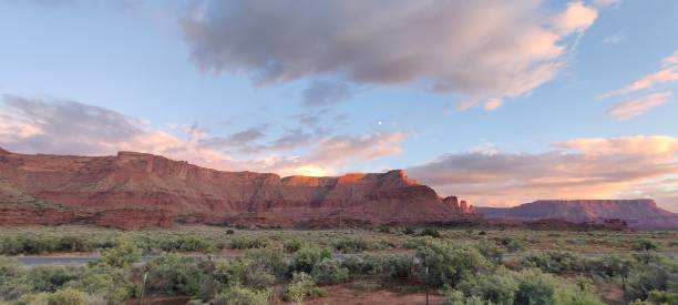 istock Panoramic view of a canyon covered with green trees and shrubs at sunset 1455441873
