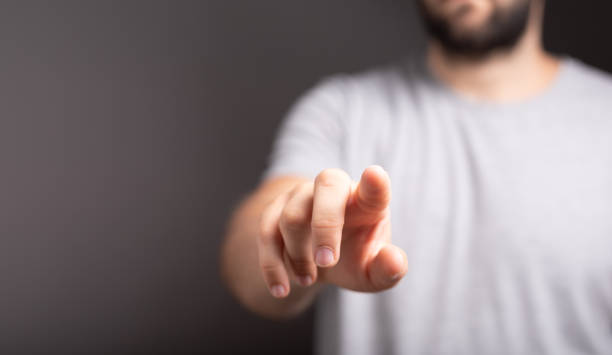 istock Closeup of man  pointing with copy space 1455445410